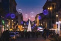 Busy Etnea street decorated with festive New Year illumination lights, Catania, Sicily