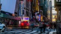 Busy evening on 42nd street with sunset colors on sky