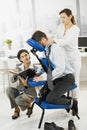 Busy executive getting massage in office Royalty Free Stock Photo