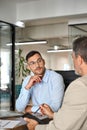 Busy executive team of two business men working in office talking with laptop. Royalty Free Stock Photo