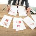 Busy financial adviser working at his business desk with many do