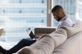 Busy focused young business man working at home, using laptop Royalty Free Stock Photo