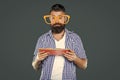 busy funny bearded man in party glasses read book