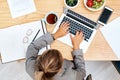 Busy getting everything done to ensure she succeeds. High angle shot of a young businesswoman working on a laptop in an