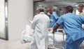 Busy, healthcare and doctors rush with patient, surgery and ready for procedure in hospital. Fast team, medical Royalty Free Stock Photo