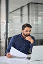 Busy Indian business man employee participating hybrid meeting in office. Royalty Free Stock Photo