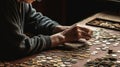 A person counting coins on a table created with Generative AI