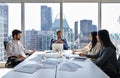 Busy international professional business team at group meeting in board room. Royalty Free Stock Photo
