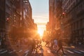 Busy intersection with crowds of people walking across the intersection at 23rd Street and 5th Avenue in New York City with sunset Royalty Free Stock Photo