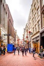 The busy Kalverstraat, a famous and touristic shopping street in the center of the old city of Amsterdam