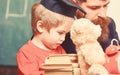 Busy kid studying at school. Individual studying concept. Teacher, father checking homework, helps to boy, son. Teacher Royalty Free Stock Photo