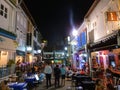 Busy and lively Singapore streets by night. Royalty Free Stock Photo