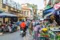 Busy local daily life of the morning street market in Hanoi, Vietnam. A busy crowd of sellers and buyers in the market. Royalty Free Stock Photo