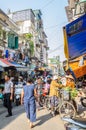 Busy local daily life of the morning street market in Hanoi, Vietnam. A busy crowd of sellers and buyers in the market.