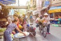 Busy local daily life of the morning street market in Hanoi, Vietnam. People can seen exploring around the market.