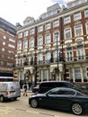 Busy London street with people cars in Westminster London UK