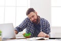 Busy man has business lunch in modern office interior Royalty Free Stock Photo