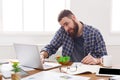 Busy man has business lunch in modern office interior Royalty Free Stock Photo