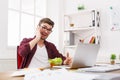 Busy man has business lunch in modern office interior Royalty Free Stock Photo