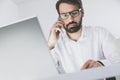 Busy man on his phone with a client Royalty Free Stock Photo