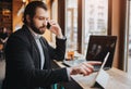 Busy man is in a hurry, he does not have time, he is going to eating and working. Worker eating, drinking coffee Royalty Free Stock Photo