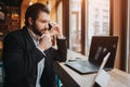 Busy man is in a hurry, he does not have time, he is going to eating and working. Worker eating, drinking coffee Royalty Free Stock Photo