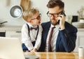 Busy man with kid working from home Royalty Free Stock Photo