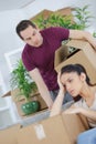 busy man packing books and tired wife Royalty Free Stock Photo