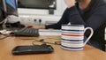 Busy man working late sitting at desk Royalty Free Stock Photo