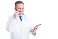 Busy medic or doctor multitasking with phone and tablet Royalty Free Stock Photo