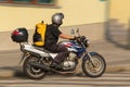 Busy messenger on motorcycle Royalty Free Stock Photo