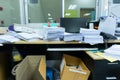 Busy, messy and cluttered workplace, full of documents