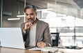 Busy middle aged business man at office desk working on laptop. Copy space Royalty Free Stock Photo