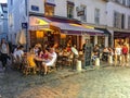 Busy Montmartre cafe and street scene, Paris Royalty Free Stock Photo