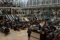 Busy morning at London Paddington Railway Station with crowd of people Royalty Free Stock Photo