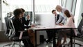 Busy multiracial employees working in co-working open space