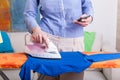 Busy mum during ironing Royalty Free Stock Photo