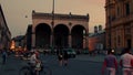 busy Munich street scene with Feldherrenhalle in twilight