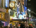 Busy Night Street With Crowd of People in Front of Macys with holiday decorations