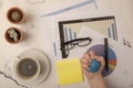 Busy office desk with hand squeezing stress ball Royalty Free Stock Photo