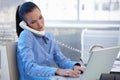 Busy office girl working with phone and computer Royalty Free Stock Photo