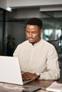 Busy professional African business man employee using laptop working in office. Royalty Free Stock Photo