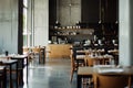 Busy Restaurant With Abundance of Tables and Chairs for Customers to Enjoy, A modern minimalist design of an empty restaurant Royalty Free Stock Photo