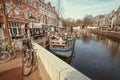 Busy riverboat cafe with customers, at dinner time on channels of old city