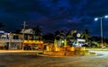 Busy road street driving cars traffic jam traffic circle night Royalty Free Stock Photo