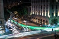 Busy Rome street with tram rides at night with light trail. Long exposure photo Royalty Free Stock Photo
