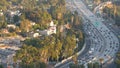 Busy rush hour intercity highway in metropolis, Los Angeles, California USA. Urban traffic jam on road in sunlight. Aerial view of Royalty Free Stock Photo