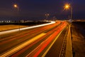 Busy rush hour traffic leaves light trails on the A9 highway Royalty Free Stock Photo