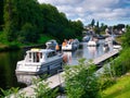 A busy scene on a calm, summer day on the Caledonian Canal at Fort Augustus, Scotland, UK