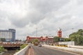 Busy scene in front of famous ancient railway station,vehicles pass by traffic signal,people are waiting to cross the road Royalty Free Stock Photo